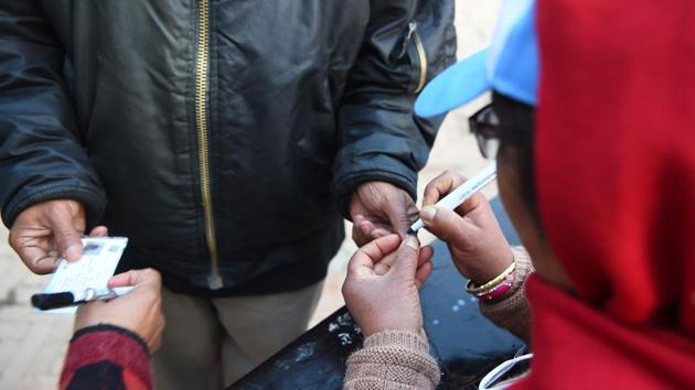 A Nepali election official marks a voter’s finger with indelible ink at a polling station during the second round of general elections in Kathmandu on December 7. (AFP Photo) A Nepali election official marks a voter’s finger with indelible ink at a polling station during the second round of general elections in Kathmandu on December 7. (AFP Photo)