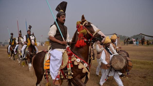 Horse riders holding lances used to pick up pegs prepare for a round of tent-pegging. Diehard fans of the cavalry sport worry that the tradition is on its last legs, in the absence of official support and a lack of popularity among the young, urban Pakistani masses. (Aamir Qureshi / AFP) Horse riders holding lances used to pick up pegs prepare for a round of tent-pegging. Diehard fans of the cavalry sport worry that the tradition is on its last legs, in the absence of official support and a lack of popularity among the young, urban Pakistani masses. (Aamir Qureshi / AFP)