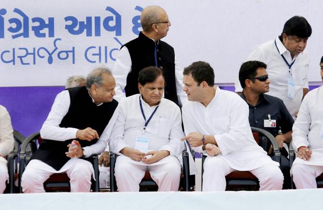 Congress vice-president Rahul Gandhi with senior leaders Ahmed Patel and Ashok Gehlot during a public meeting in Bharuch.(PTI File Photo)