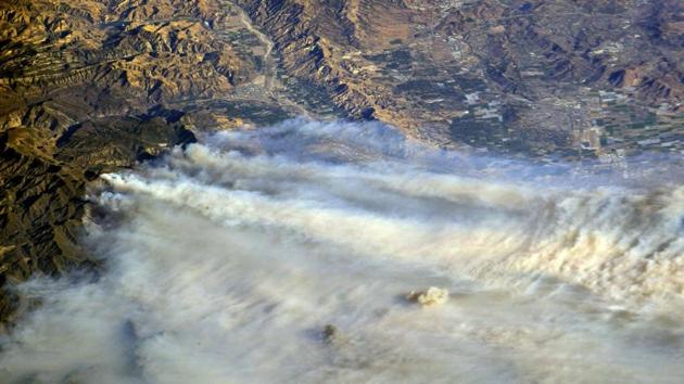 A photo taken from the International Space Station and moved on social media by astronaut Randy Bresnik shows smoke rising from Skirball in Southern California. Four major wildfires burning in Los Angeles and Ventura counties have already put tens of thousands of people under evacuation orders and destroyed nearly 200 homes and buildings. (AstroKomrade / NASA / REUTERS) A photo taken from the International Space Station and moved on social media by astronaut Randy Bresnik shows smoke rising from Skirball in Southern California. Four major wildfires burning in Los Angeles and Ventura counties have already put tens of thousands of people under evacuation orders and destroyed nearly 200 homes and buildings. (AstroKomrade / NASA / REUTERS)