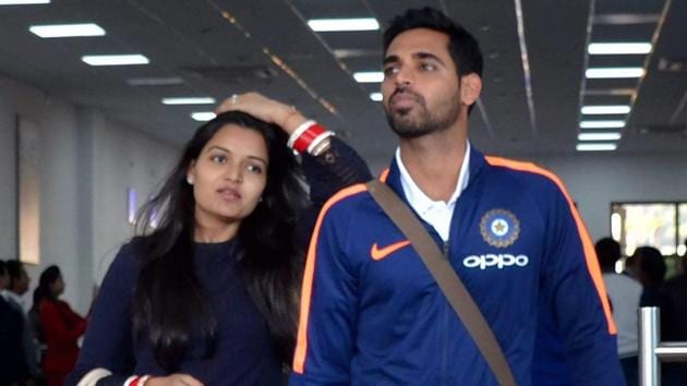 Bhuvneshwar Kumar along with wife Nupur arrives at Gaggal airport near Dharamsala on Thursday. (PTI)