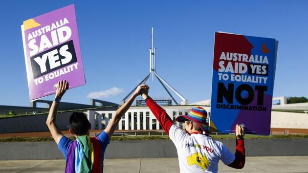 Equality ambassadors and volunteers from the The Equality Campaign gather in front of Parliament House in Canberra. (AFP Photo) Equality ambassadors and volunteers from the The Equality Campaign gather in front of Parliament House in Canberra. (AFP Photo)