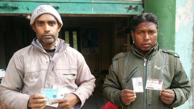 Afrazul’s nephew and son-in-law with documents and identity cards of the deceased.(HT Photo)