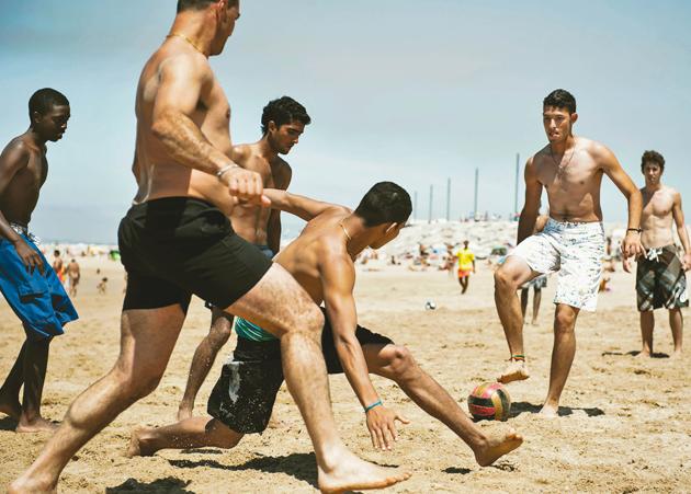 Boys play beach football in Spain(Shutterstock)