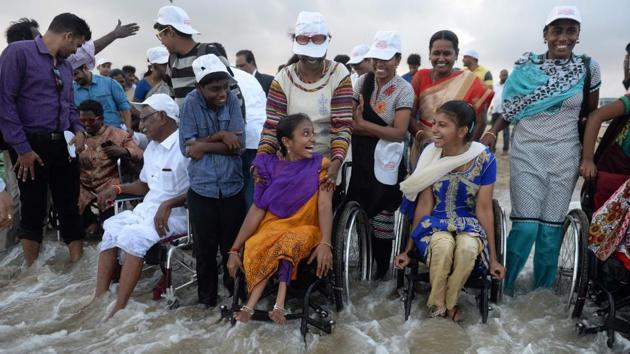 Physically challenged people react as they enjoy a day out at Elliot's beach on the occasion of International Day of Disabled Persons in Chennai on December 3, 2017. (Arun Sankar / AFP) Physically challenged people react as they enjoy a day out at Elliot's beach on the occasion of International Day of Disabled Persons in Chennai on December 3, 2017. (Arun Sankar / AFP)