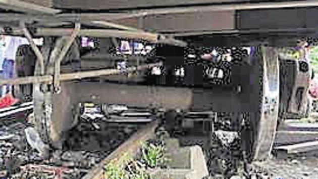 The goods train derailed near Parsik tunnel in Thane on Wednesday. (Praful Gangurde) The goods train derailed near Parsik tunnel in Thane on Wednesday. (Praful Gangurde)