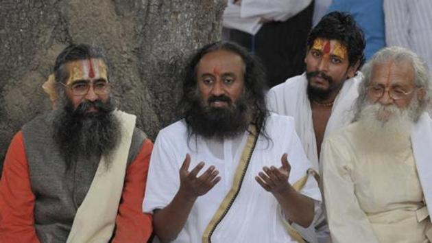 The National Green Tribunal has held Sri Sri Ravi Shankar’s Art of Living “responsible” for causing damage to the Yamuna floodplains by conducting the World Culture Festival in 2016(HT) The National Green Tribunal has held Sri Sri Ravi Shankar’s Art of Living “responsible” for causing damage to the Yamuna floodplains by conducting the World Culture Festival in 2016(HT)