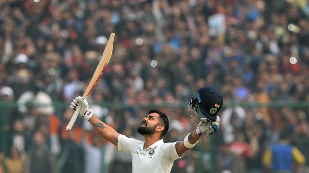 Virat Kohli raises his bat after completing his double century (200 runs) during the 2nd day of the 3rd Test match between India and Sri Lanka at the Feroz Shah Kotla Cricket Stadium in New Delhi on December 3, 2017. (Sajjad Hussain / AFP) Virat Kohli raises his bat after completing his double century (200 runs) during the 2nd day of the 3rd Test match between India and Sri Lanka at the Feroz Shah Kotla Cricket Stadium in New Delhi on December 3, 2017. (Sajjad Hussain / AFP)