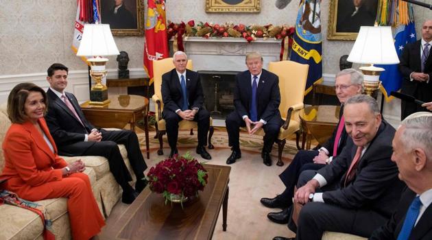 US President Donald Trump, alongside vice president Mike Pence (third from left), meets the Congressional leadership, including Senate majority leader Mitch McConnell, Senate minority leader Chuck Schumer, Speaker of the House Paul Ryan, and House Democratic leader Nancy Pelosi in the Oval Office at the White House in Washington on December 7, 2017. (AFP) US President Donald Trump, alongside vice president Mike Pence (third from left), meets the Congressional leadership, including Senate majority leader Mitch McConnell, Senate minority leader Chuck Schumer, Speaker of the House Paul Ryan, and House Democratic leader Nancy Pelosi in the Oval Office at the White House in Washington on December 7, 2017. (AFP)