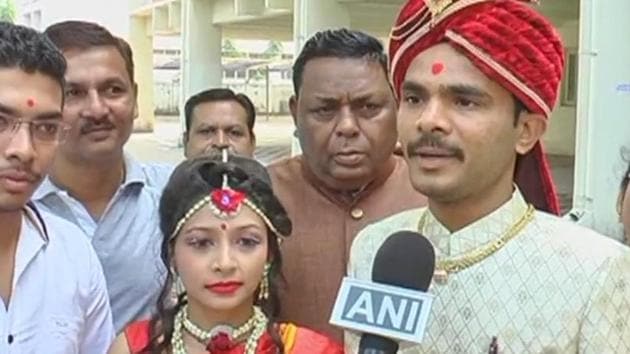 A couple in Bharuch cast their votes before their wedding ceremony. (ANI) A couple in Bharuch cast their votes before their wedding ceremony. (ANI)