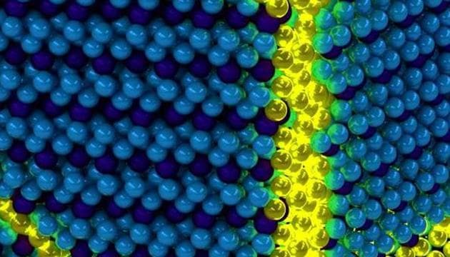Artist’s depiction of the collective excitons of an excitonic solid. These excitations can be thought of as propagating domain walls (yellow) in an otherwise ordered solid exciton background (blue). (Representative Photo/ U. of I. Department of Physics and Frederick Seitz Materials Research Laboratory.) Artist’s depiction of the collective excitons of an excitonic solid. These excitations can be thought of as propagating domain walls (yellow) in an otherwise ordered solid exciton background (blue). (Representative Photo/ U. of I. Department of Physics and Frederick Seitz Materials Research Laboratory.)