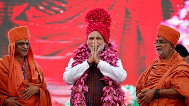 PM Narendra Modi greets his supporters during an election campaign meeting ahead of Gujarat state assembly elections in Ahmedabad on December 3, 2017. (Amit Dave / REUTERS) PM Narendra Modi greets his supporters during an election campaign meeting ahead of Gujarat state assembly elections in Ahmedabad on December 3, 2017. (Amit Dave / REUTERS)