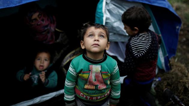 A Syrian refugee boy in front of his family tent at a makeshift camp. According to aid workers, there is an acute shortage of medical care. (Alkis Konstantinidis / REUTERS) A Syrian refugee boy in front of his family tent at a makeshift camp. According to aid workers, there is an acute shortage of medical care. (Alkis Konstantinidis / REUTERS)