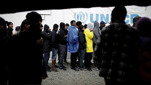 Refugees and migrants line up for lunch provided by the Greek authorities, at a makeshift camp. The European Commission claims to have offered Greece millions in emergency aid and that it was working with the Greek authorities to improve living conditions. (Alkis Konstantinidis / REUTERS) Refugees and migrants line up for lunch provided by the Greek authorities, at a makeshift camp. The European Commission claims to have offered Greece millions in emergency aid and that it was working with the Greek authorities to improve living conditions. (Alkis Konstantinidis / REUTERS)