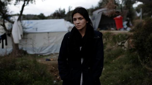 Iraqi refugee Shahed Naji, 22, who arrived in Moria five months ago, stands at a makeshift camp for refugees in Lesbos, Greece. Gangs, some armed with knives, roam at night while women cower in their shelters for fear of an attack. “Any girl in this camp expects at any moment that she will be attacked,” said Naji. (Alkis Konstantinidis / REUTERS) Iraqi refugee Shahed Naji, 22, who arrived in Moria five months ago, stands at a makeshift camp for refugees in Lesbos, Greece. Gangs, some armed with knives, roam at night while women cower in their shelters for fear of an attack. “Any girl in this camp expects at any moment that she will be attacked,” said Naji. (Alkis Konstantinidis / REUTERS)