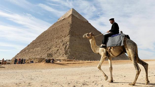 A police officer patrols the Giza Pyramids on his camel on the outskirts of Cairo, Egypt on December 6, 2017. (Mohamed Abd El Ghany / REUTERS) 