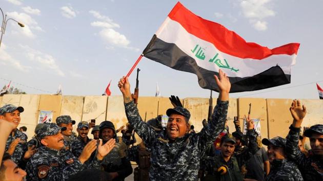 A member of Iraqi Federal Police waves an Iraqi flag as they celebrate victory of military operations against the Islamic State militants in West Mosul, Iraq. (Reuters File Photo) A member of Iraqi Federal Police waves an Iraqi flag as they celebrate victory of military operations against the Islamic State militants in West Mosul, Iraq. (Reuters File Photo)