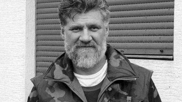 In this Sept. 1991 photo, Slobodan Praljak holds a hand-grenade as he poses near a front-line in Sunja, Croatia. Slobodan Praljak stunned the International Criminal Tribunal for the former Yugoslavia on Wednesday when he gulped down liquid from a small bottle seconds after a UN appeals judge had confirmed a 20-year sentence against him.(AP)