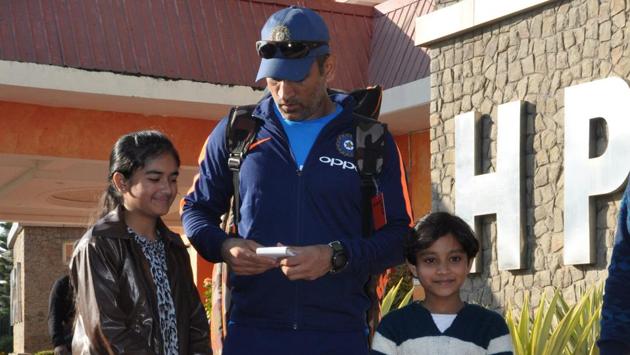 MS Dhoni (C) signing a few autographs for kids in Dharamsala. (Shyam Sharma / Hindustan Times) MS Dhoni (C) signing a few autographs for kids in Dharamsala. (Shyam Sharma / Hindustan Times)