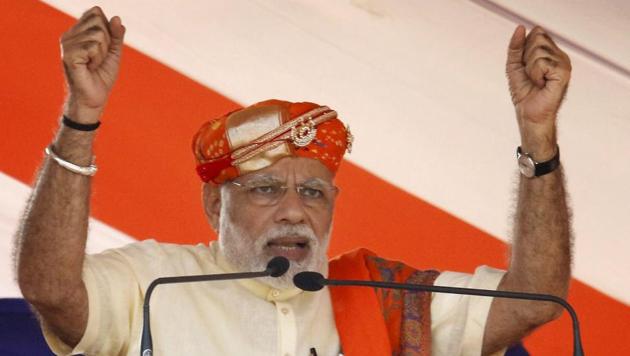 Prime Minister Narendra Modi addresses a rally for election in Lunawada town of Panchmahal district of Gujarat on Saturday. (PTI) Prime Minister Narendra Modi addresses a rally for election in Lunawada town of Panchmahal district of Gujarat on Saturday. (PTI)