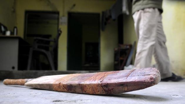 Greater Noida, India - December 06, 2017: The bat was allegedly used in crime to hit the woman and daughter in the head, in Greater Noida, India, on Wednesday, December 06, 2017. (Photo by Sunil Ghosh / Hindustan Times)