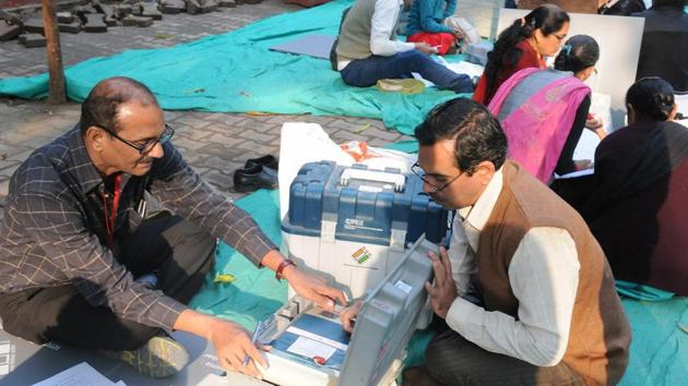 Polling officials check the EVMs in Surat on the eve of the first phase of the Gujarat assembly election. (PTI Photo) Polling officials check the EVMs in Surat on the eve of the first phase of the Gujarat assembly election. (PTI Photo)