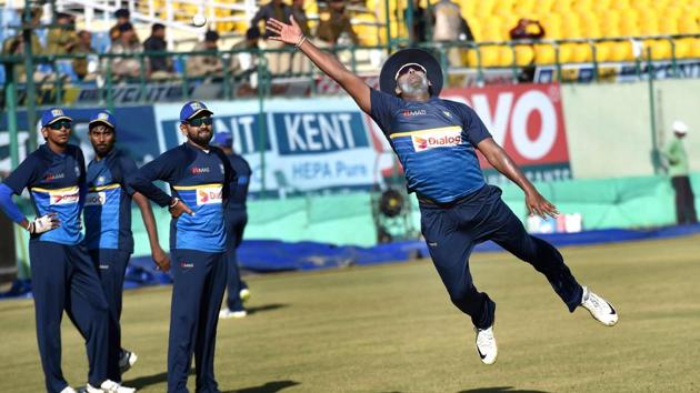 Sri Lankan captain Thisara Perera jumps for a catch during their practice session ahead of the first ODI against India at the HPCA Stadium in Dharamshala on Saturday. (PTI) Sri Lankan captain Thisara Perera jumps for a catch during their practice session ahead of the first ODI against India at the HPCA Stadium in Dharamshala on Saturday. (PTI)
