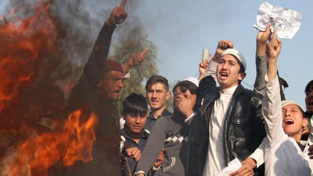 Afghan protesters burn an effigy of US President Donald Trump during a protest in Jalalabad on December 10, 2017, following US President Donald Trump's decision to officially recognise Jerusalem as the Israeli capital. (AFP Photo) Afghan protesters burn an effigy of US President Donald Trump during a protest in Jalalabad on December 10, 2017, following US President Donald Trump's decision to officially recognise Jerusalem as the Israeli capital. (AFP Photo)