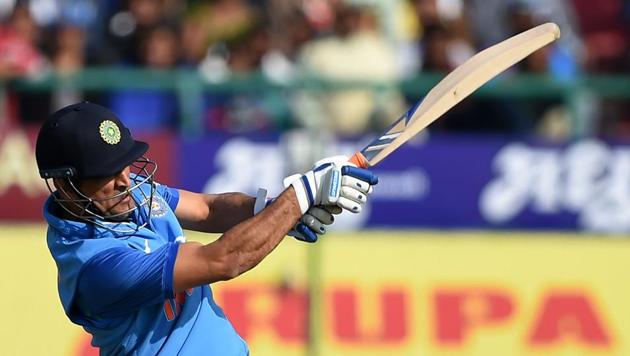 Indian cricketer Mahendra Singh Dhoni plays a shot during the first One day international (ODI) match between India and Sri Lanka at the Himachal Pradesh Cricket Association stadium in Dharamshala on December 10, 2017. Dhoni top-scored for India with 65.(AFP)