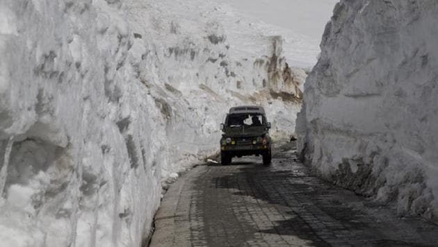 An army vehicle drives past walls of snow on the Zojila Pass, about 110 kilometers (68 miles) north of Srinagar, on April 30, 2016. (AP File Photo) An army vehicle drives past walls of snow on the Zojila Pass, about 110 kilometers (68 miles) north of Srinagar, on April 30, 2016. (AP File Photo)