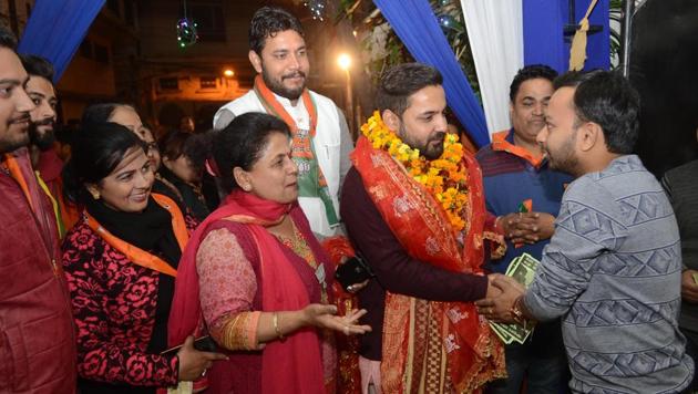 BJP candidate Himanshu Sharma during a door to door campaign in Jalandhar on Saturday. (Pardeep Pandit/HT) BJP candidate Himanshu Sharma during a door to door campaign in Jalandhar on Saturday. (Pardeep Pandit/HT)