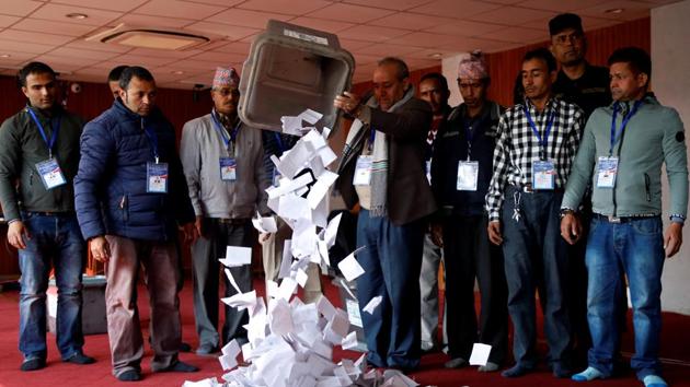 An official from the election commission pours the ballot papers from the box, as officials start counting the votes, a day after the parliamentary and provincial elections in Kathmandu, Nepal December 8, 2017. (REUTERS Photo) An official from the election commission pours the ballot papers from the box, as officials start counting the votes, a day after the parliamentary and provincial elections in Kathmandu, Nepal December 8, 2017. (REUTERS Photo)