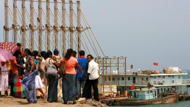 A file photo of a group of Sri Lankan visitors at the new deep water shipping port watch Chinese dredging ships work in Hambantota on March 24, 2010. (Reuters) A file photo of a group of Sri Lankan visitors at the new deep water shipping port watch Chinese dredging ships work in Hambantota on March 24, 2010. (Reuters)