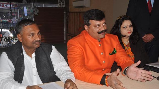 Khanpur MLA Kunwar Pranav Singh 'Champion' (centre) addresses a press conference in the capital on Monday. (Vinay Santosh Kumar/HT) Khanpur MLA Kunwar Pranav Singh 'Champion' (centre) addresses a press conference in the capital on Monday. (Vinay Santosh Kumar/HT)
