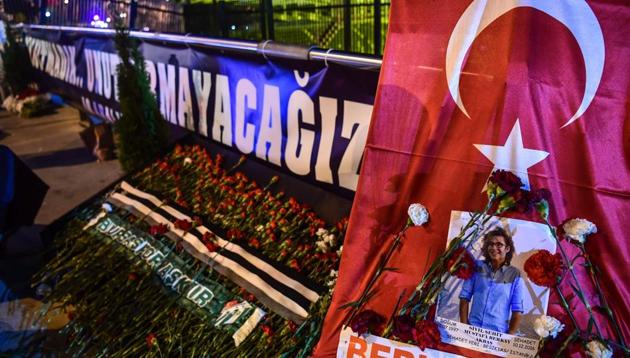 Flowers left by people are pictured at the site during a cerenomy marking the first anniversary of the Vodaphone stadium attack, on December 10, 2017 near the stadium in Istanbul. Turkish football giants Besiktas paid tribute on December 10 to 46 people killed in twin bombings near the team's stadium, starting a day of commemorations to mark the first anniversary of the attacks. (AFP Photo) Flowers left by people are pictured at the site during a cerenomy marking the first anniversary of the Vodaphone stadium attack, on December 10, 2017 near the stadium in Istanbul. Turkish football giants Besiktas paid tribute on December 10 to 46 people killed in twin bombings near the team's stadium, starting a day of commemorations to mark the first anniversary of the attacks. (AFP Photo)