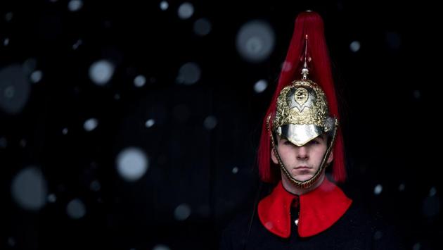 A member of the Household Cavalry is seen on guard at Horse Guard's Parade as snow falls on the British capital on December 10, 2017. The Met Office issued a yellow weather warning for snow and ice across much of the United Kingdom. (Chris J Ratcliffe / Getty Images) A member of the Household Cavalry is seen on guard at Horse Guard's Parade as snow falls on the British capital on December 10, 2017. The Met Office issued a yellow weather warning for snow and ice across much of the United Kingdom. (Chris J Ratcliffe / Getty Images)