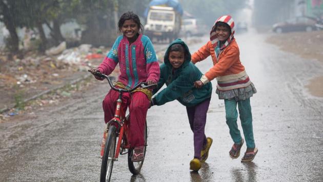 Kids enjoying a cycle ride in Ludhiana on Monday. (gurpreet singh/ht) 