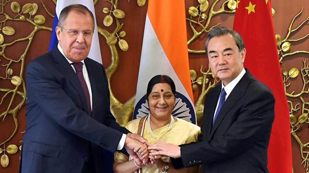 External affairs minister Sushma Swaraj (C) with her Chinese counterpart Wang Yi (R) and Russian foreign minister Sergey Lavrov before the Russia-India-China Foreign Ministerial Meeting at Jawahar Lal Nehru Bhawan in New Delhi on Monday. (PTI) External affairs minister Sushma Swaraj (C) with her Chinese counterpart Wang Yi (R) and Russian foreign minister Sergey Lavrov before the Russia-India-China Foreign Ministerial Meeting at Jawahar Lal Nehru Bhawan in New Delhi on Monday. (PTI)