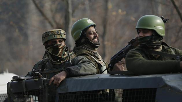 Army soldiers share a lighter moment as they guard during a gunbattle at Pakharpore village, south of Srinagar, Kashmir, on Nov. 30, 2017. (AP) Army soldiers share a lighter moment as they guard during a gunbattle at Pakharpore village, south of Srinagar, Kashmir, on Nov. 30, 2017. (AP)