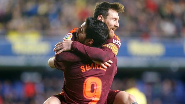 Lionel Messi and Luis Suarez guided FC Barcelona to a 2-0 win over Villarreal in La Liga. (REUTERS) Lionel Messi and Luis Suarez guided FC Barcelona to a 2-0 win over Villarreal in La Liga. (REUTERS)