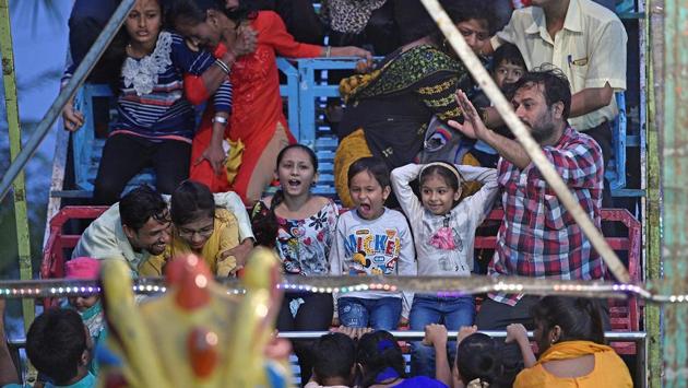 People enjoy a toy boat ride at the fair. (Shashi S Kashyap/HT PHOTO) 