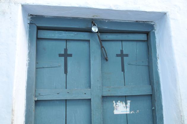 Holy cross on the door of a newly converted Christian house in village Bandri in Sagar district in Madhya Pradesh.(Mujeeb Faruqui/HT Photo)