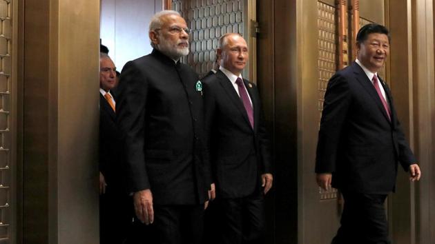 Indian Prime Minister Narendra Modi, Russian President Vladimir Putin and Chinese President Xi Jinping attend a plenary session of BRICS (Brazil, Russia, India, China and South Africa) Summit, in Xiamen, China September 4, 2017. (REUTERS File Photo) Indian Prime Minister Narendra Modi, Russian President Vladimir Putin and Chinese President Xi Jinping attend a plenary session of BRICS (Brazil, Russia, India, China and South Africa) Summit, in Xiamen, China September 4, 2017. (REUTERS File Photo)