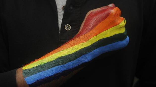 A participant holds up a fist in the colours of the LGBTQ (lesbian, gay, bisexual, transgender, queer) community’s rainbow flag during the 16th Kolkata Rainbow Pride walk. Started in 1999 as The Friendship Walk, it is one of the oldest pride marches in South Asia. While the intention of the march revolves around equality and tolerance, the participants also walk in solidarity with other rights based movements. (Samir Jana / HT PHOTO) A participant holds up a fist in the colours of the LGBTQ (lesbian, gay, bisexual, transgender, queer) community’s rainbow flag during the 16th Kolkata Rainbow Pride walk. Started in 1999 as The Friendship Walk, it is one of the oldest pride marches in South Asia. While the intention of the march revolves around equality and tolerance, the participants also walk in solidarity with other rights based movements. (Samir Jana / HT PHOTO)