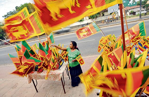 A vendor sells Sri Lankan national flags at a roadside stall in Colombo. (Ishara S Kodikara/AFP) A vendor sells Sri Lankan national flags at a roadside stall in Colombo. (Ishara S Kodikara/AFP)