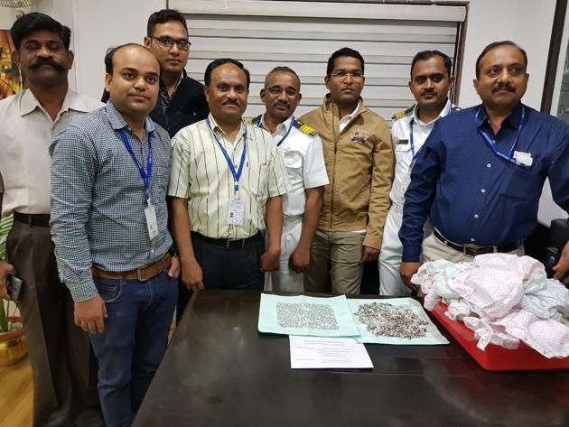 A personal search and detailed examination of the checked-in baggage resulted in the recovery of 288 gold pieces which were carefully concealed in the press buttons of 48 diapers. (HT Photo) A personal search and detailed examination of the checked-in baggage resulted in the recovery of 288 gold pieces which were carefully concealed in the press buttons of 48 diapers. (HT Photo)