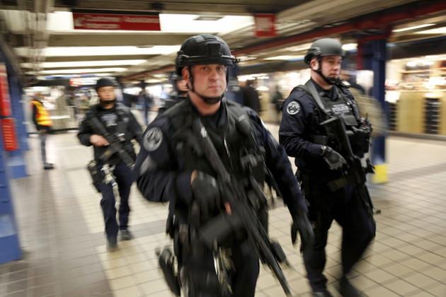 Police officers patrol in the passageway connecting New York City's Port Authority bus terminal and the Times Square subway station on December 12, near the site of Monday's explosion. (AP Photo) Police officers patrol in the passageway connecting New York City's Port Authority bus terminal and the Times Square subway station on December 12, near the site of Monday's explosion. (AP Photo)