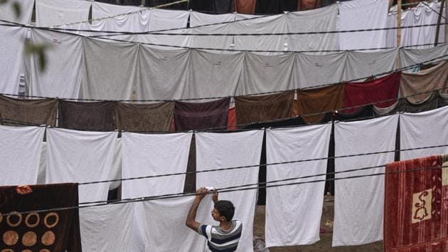 The washermen here are residents of areas adjoining their workplace such as Nizamuddin, Bhogal, Ashram and Jangpura itself. Many have been associated with this line of work for generations and have only known washing clothes as a career. (Burhaan Kinu / HT Photo) 