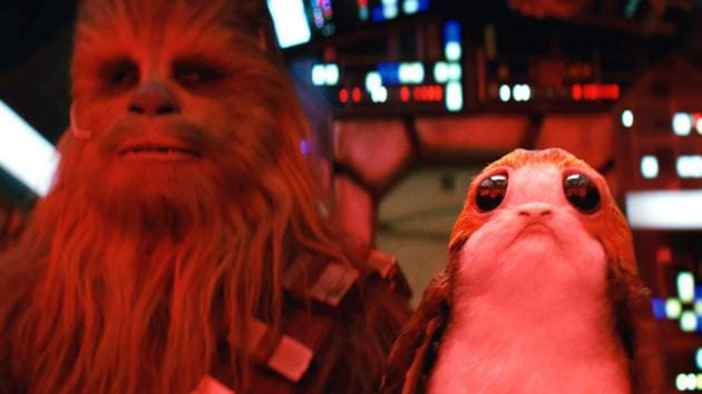 Star Wars: The Last Jedi L to R: Chewbacca and a Porg. (Lucasfilm Ltd.) Star Wars: The Last Jedi L to R: Chewbacca and a Porg. (Lucasfilm Ltd.)