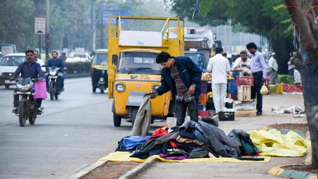 Hawkers encroaching the footpath along Raj Bhavan road on Monday. (Sanket Wankhade/HT PHOTO) Hawkers encroaching the footpath along Raj Bhavan road on Monday. (Sanket Wankhade/HT PHOTO)